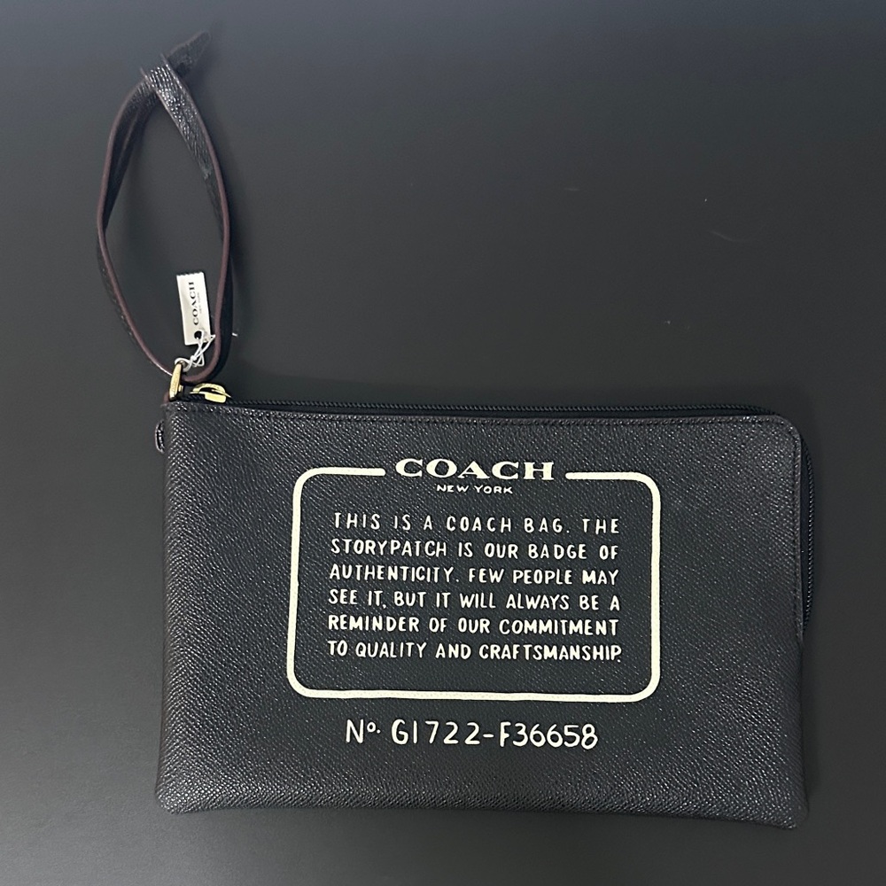 Coach NWT Black Textured Large Wristlet. Black w Maroon Tubing & Gold Hardware.